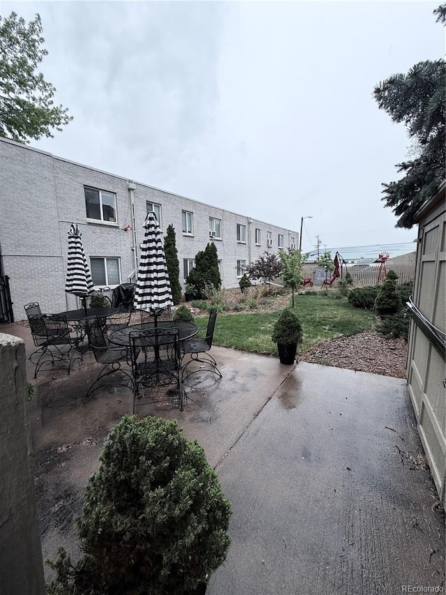 view of patio featuring fence
