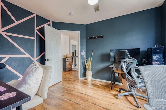 office area with hardwood / wood-style flooring and ceiling fan