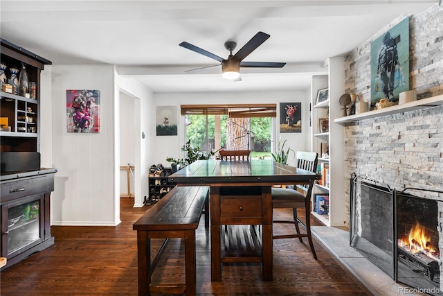 2730 S Jay St, Denver, CO 80227 - dining room with wood finished floors, a ceiling fan, a stone fireplace, and built in shelves