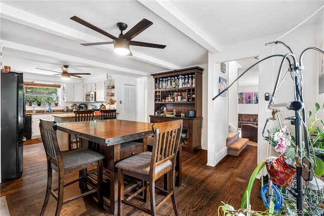2730 S Jay St, Denver, CO 80227 - dining room featuring a ceiling fan, dark wood-style flooring, beam ceiling, and stairs