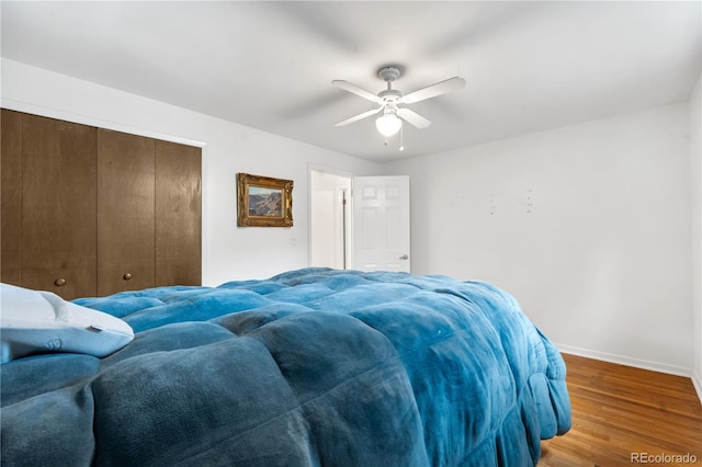 2730 S Jay St, Denver, CO 80227 - bedroom featuring wood finished floors, a closet, and a ceiling fan