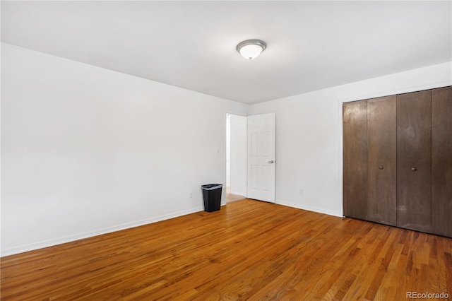 2730 S Jay St, Denver, CO 80227 - unfurnished bedroom featuring wood finished floors and a closet