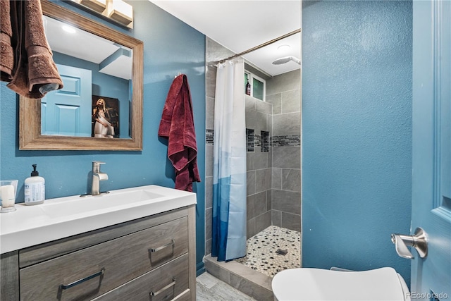 2730 S Jay St, Denver, CO 80227 - full bath featuring vanity and tiled shower