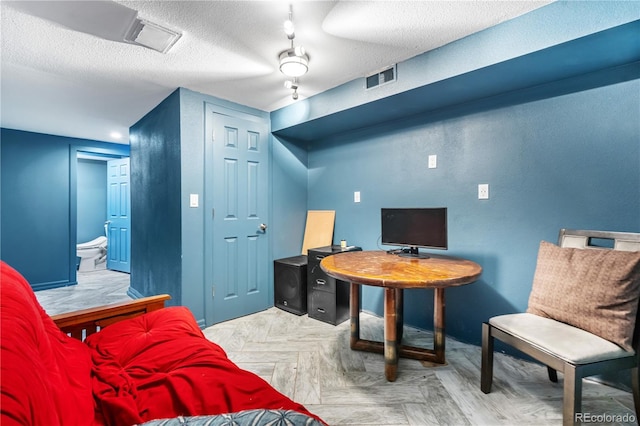 2730 S Jay St, Denver, CO 80227 - home office featuring a textured ceiling and baseboards