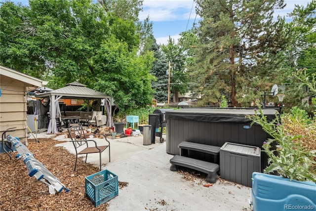 2730 S Jay St, Denver, CO 80227 - view of patio with a hot tub, a gazebo, and view of scattered trees