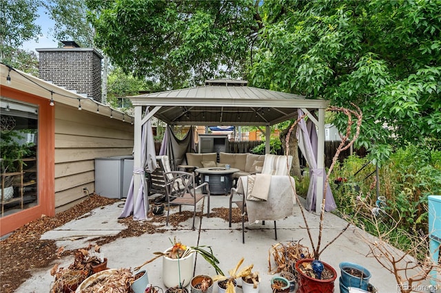 2730 S Jay St, Denver, CO 80227 - view of patio with an outdoor living space with a fire pit and a gazebo