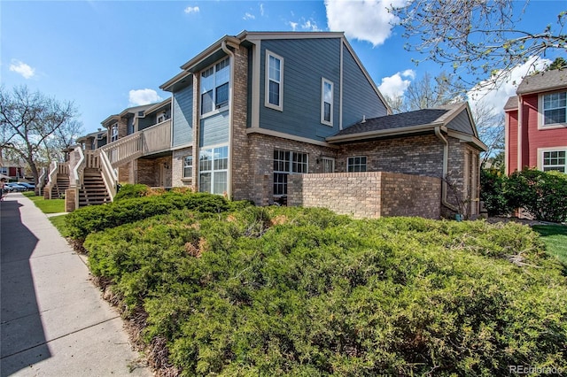 2690 E Otero Pl Unit 7, Centennial, CO 80122 - view of side of property featuring brick siding and stairs
