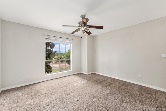 3550 S Harlan St Unit 105, Denver, CO 80235 - spare room featuring carpet floors and a ceiling fan