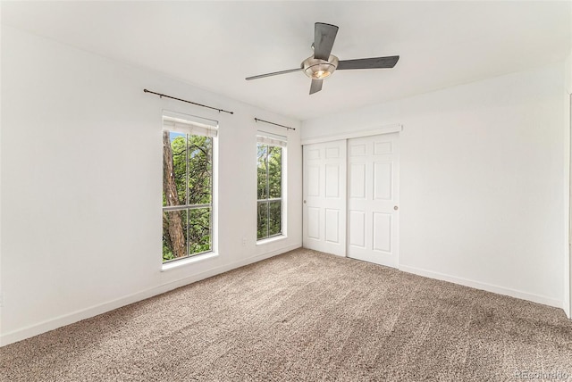 3550 S Harlan St Unit 105, Denver, CO 80235 - unfurnished bedroom with carpet floors, a closet, and ceiling fan