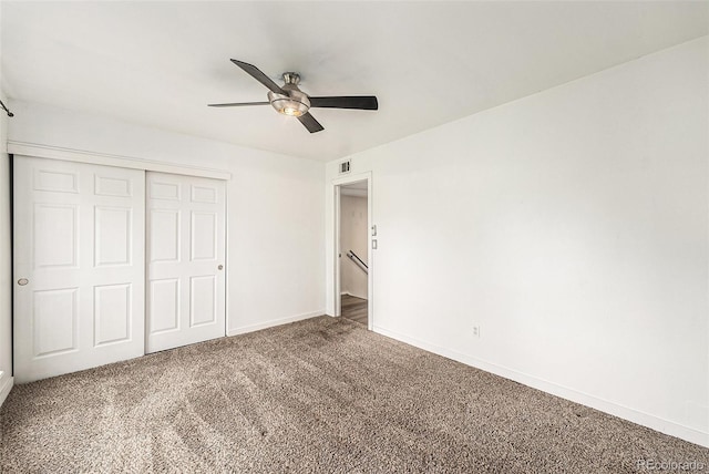 3550 S Harlan St Unit 105, Denver, CO 80235 - unfurnished bedroom featuring a closet, carpet flooring, and a ceiling fan