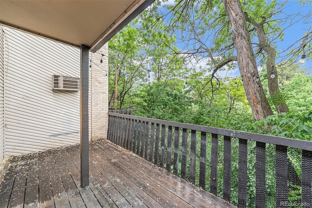 3550 S Harlan St Unit 105, Denver, CO 80235 - wooden terrace featuring a wall unit AC