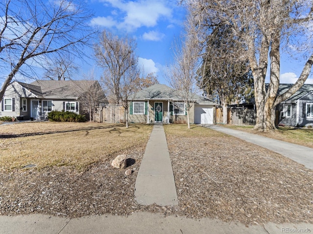 view of front of property with concrete driveway, a porch, fence, and a garage