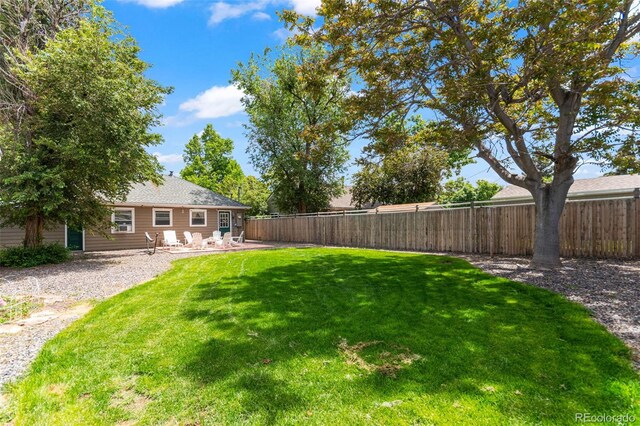 1221 Ulster St, Denver, CO 80220 - view of yard with a patio area