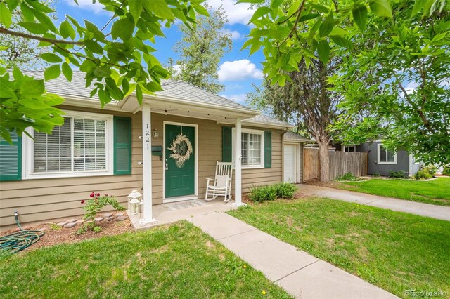 1221 Ulster St, Denver, CO 80220 - bungalow-style house with a garage, concrete driveway, and a shingled roof