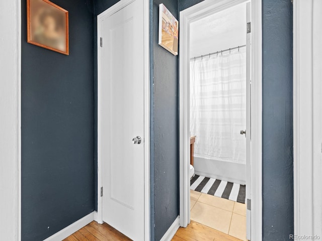 1221 Ulster St, Denver, CO 80220 - corridor with light wood-type flooring and baseboards