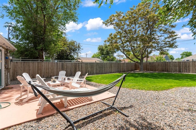 1221 Ulster St, Denver, CO 80220 - view of yard featuring a patio area and a fire pit