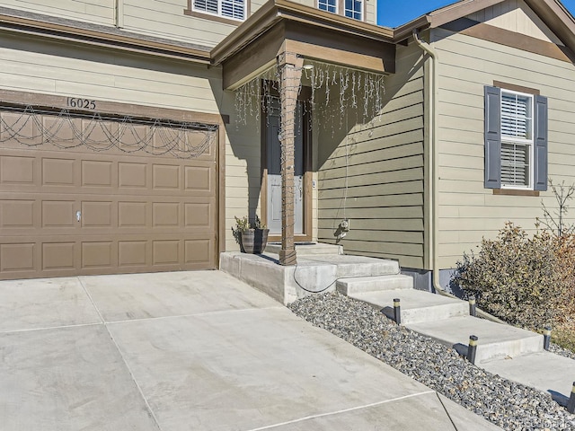 view of exterior entry with a garage