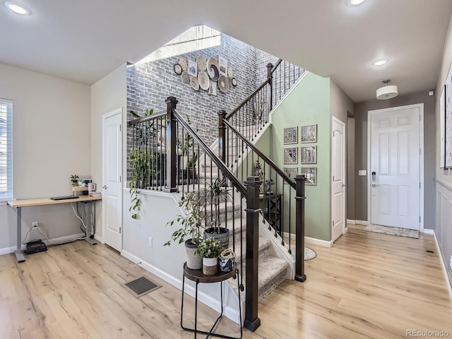 entryway with light hardwood / wood-style flooring