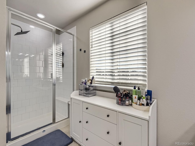 bathroom with a shower with shower door