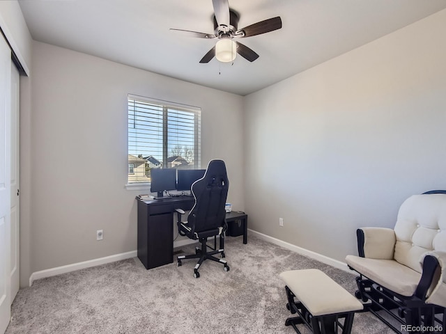 office featuring ceiling fan and light carpet