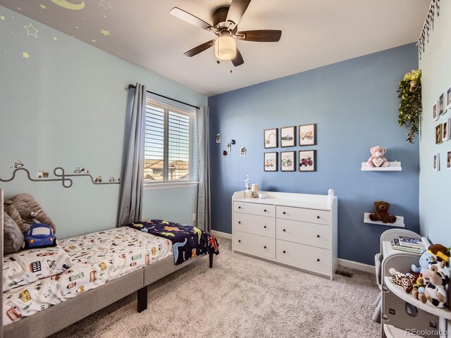 carpeted bedroom featuring ceiling fan