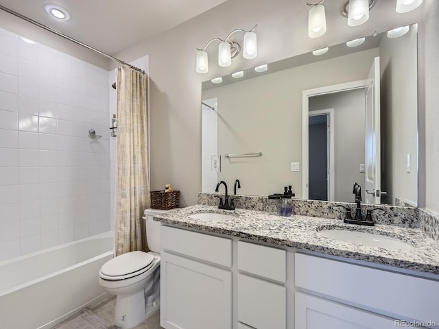 full bathroom featuring vanity, shower / bathtub combination with curtain, and toilet