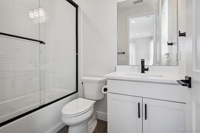 full bathroom with vanity, toilet, visible vents, and enclosed tub / shower combo