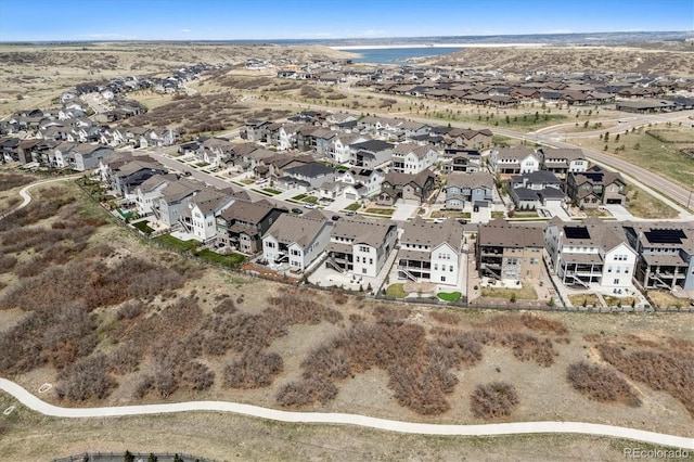 6851 Copper Sky Cir, Castle Pines, CO 80108 - aerial view of property and surrounding area with nearby suburban area and a large body of water