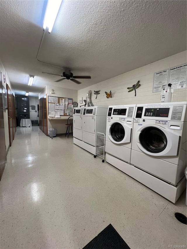 laundry area with ceiling fan, a textured ceiling, and washing machine and dryer