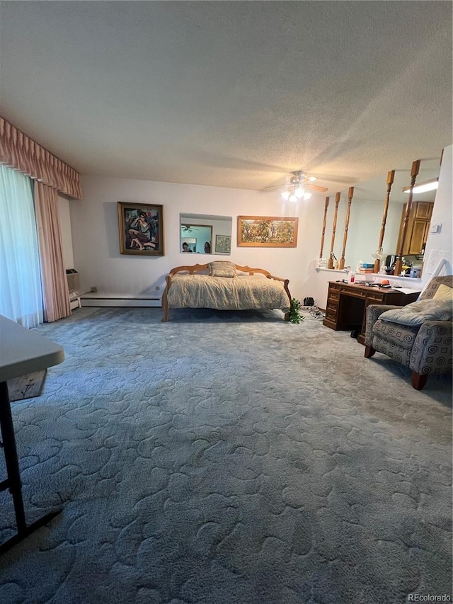 bedroom with carpet floors, a textured ceiling, a baseboard heating unit, and ceiling fan