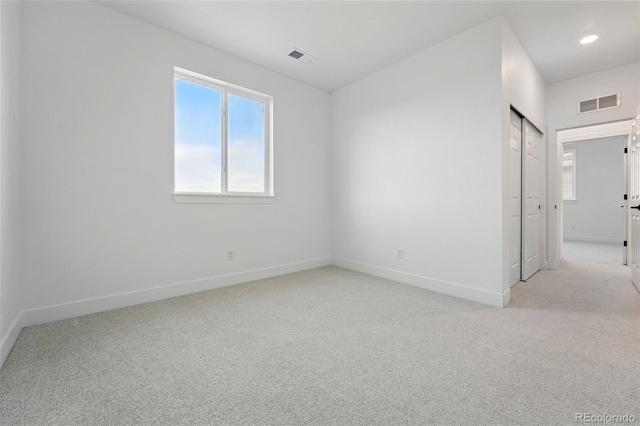 16549 Black Rose Cir, Parker, CO 80134 - spare room with light colored carpet, visible vents, baseboards, and a wealth of natural light