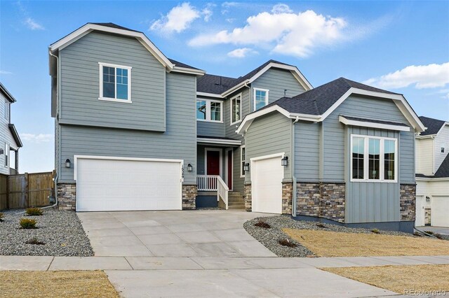 16549 Black Rose Cir, Parker, CO 80134 - craftsman inspired home with stone siding, driveway, a garage, and fence