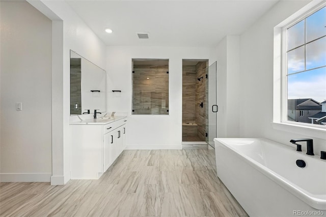 16549 Black Rose Cir, Parker, CO 80134 - bathroom featuring visible vents, a shower stall, baseboards, vanity, and a freestanding bath