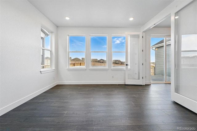 16549 Black Rose Cir, Parker, CO 80134 - unfurnished room with dark wood-style floors, recessed lighting, baseboards, and a healthy amount of sunlight