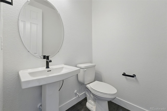 16549 Black Rose Cir, Parker, CO 80134 - bathroom with toilet, wood finished floors, and baseboards