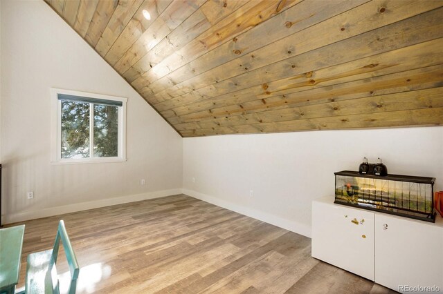 additional living space with hardwood / wood-style floors, wood ceiling, and vaulted ceiling