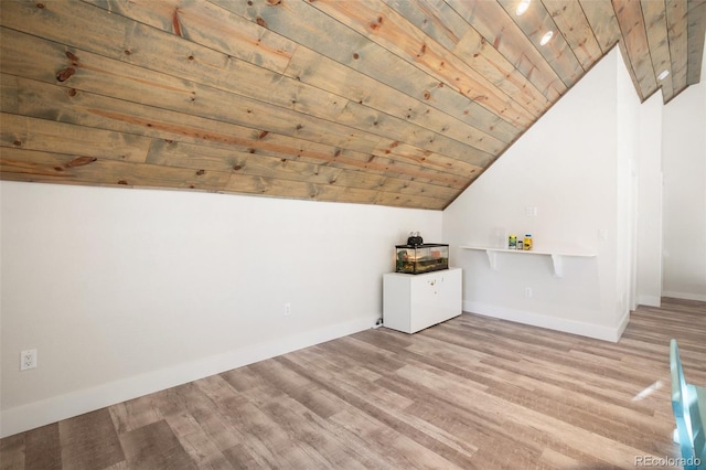 additional living space featuring light wood-type flooring, wooden ceiling, and vaulted ceiling