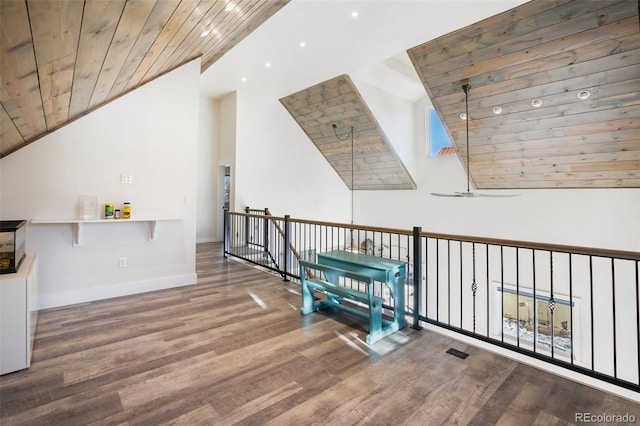 interior space with ceiling fan, wood-type flooring, wooden ceiling, and high vaulted ceiling