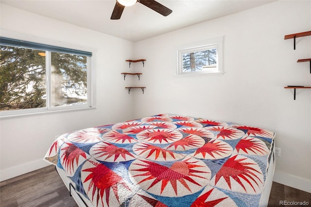 bedroom featuring dark hardwood / wood-style flooring and ceiling fan