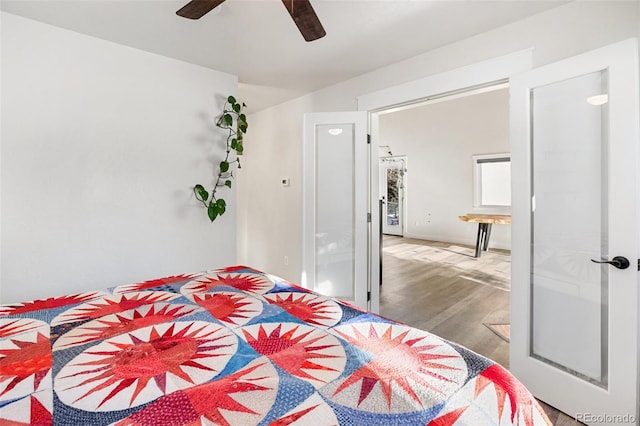 bedroom with hardwood / wood-style floors and ceiling fan