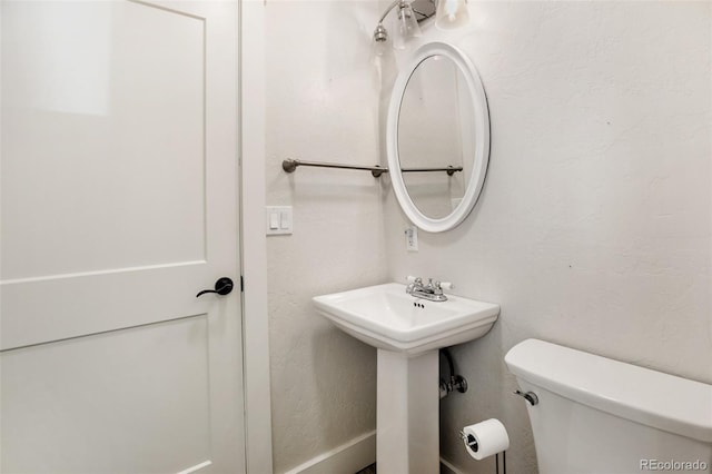 bathroom with sink and toilet