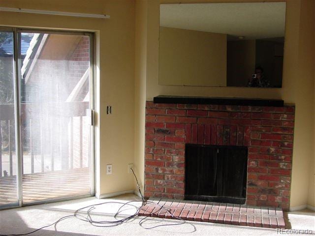 unfurnished living room featuring a fireplace