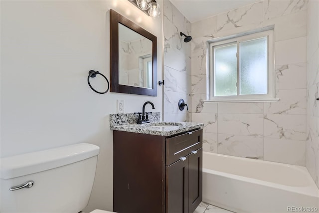 bathroom featuring toilet, marble finish floor,  shower combination, and vanity