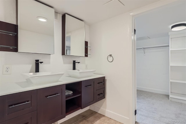 bathroom featuring double vanity and tile patterned floors