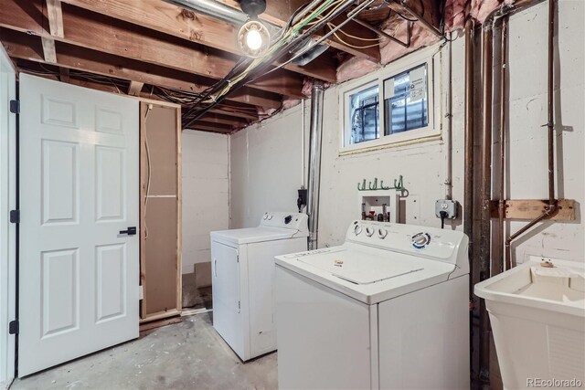 laundry area featuring independent washer and dryer and sink