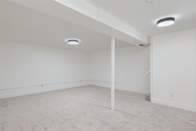 basement with light colored carpet