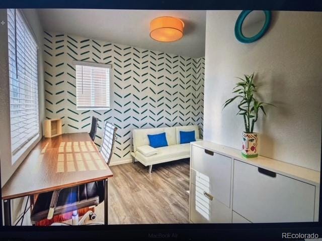 sitting room with light hardwood / wood-style flooring