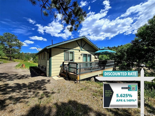 162 Pine Trl, Bailey, CO 80421 - view of property exterior with a wooden deck