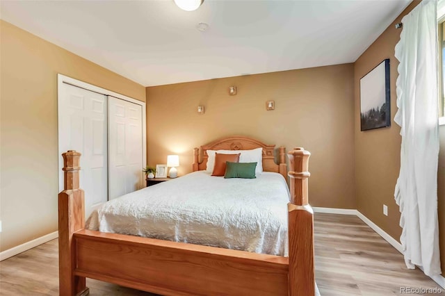 162 Pine Trl, Bailey, CO 80421 - bedroom featuring wood finished floors and a closet