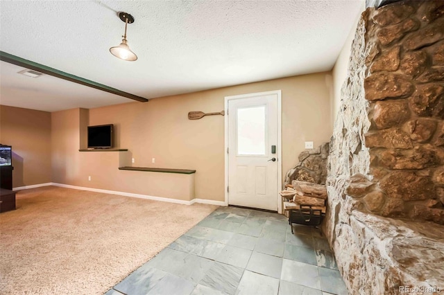 162 Pine Trl, Bailey, CO 80421 - carpeted foyer entrance with a textured ceiling and baseboards